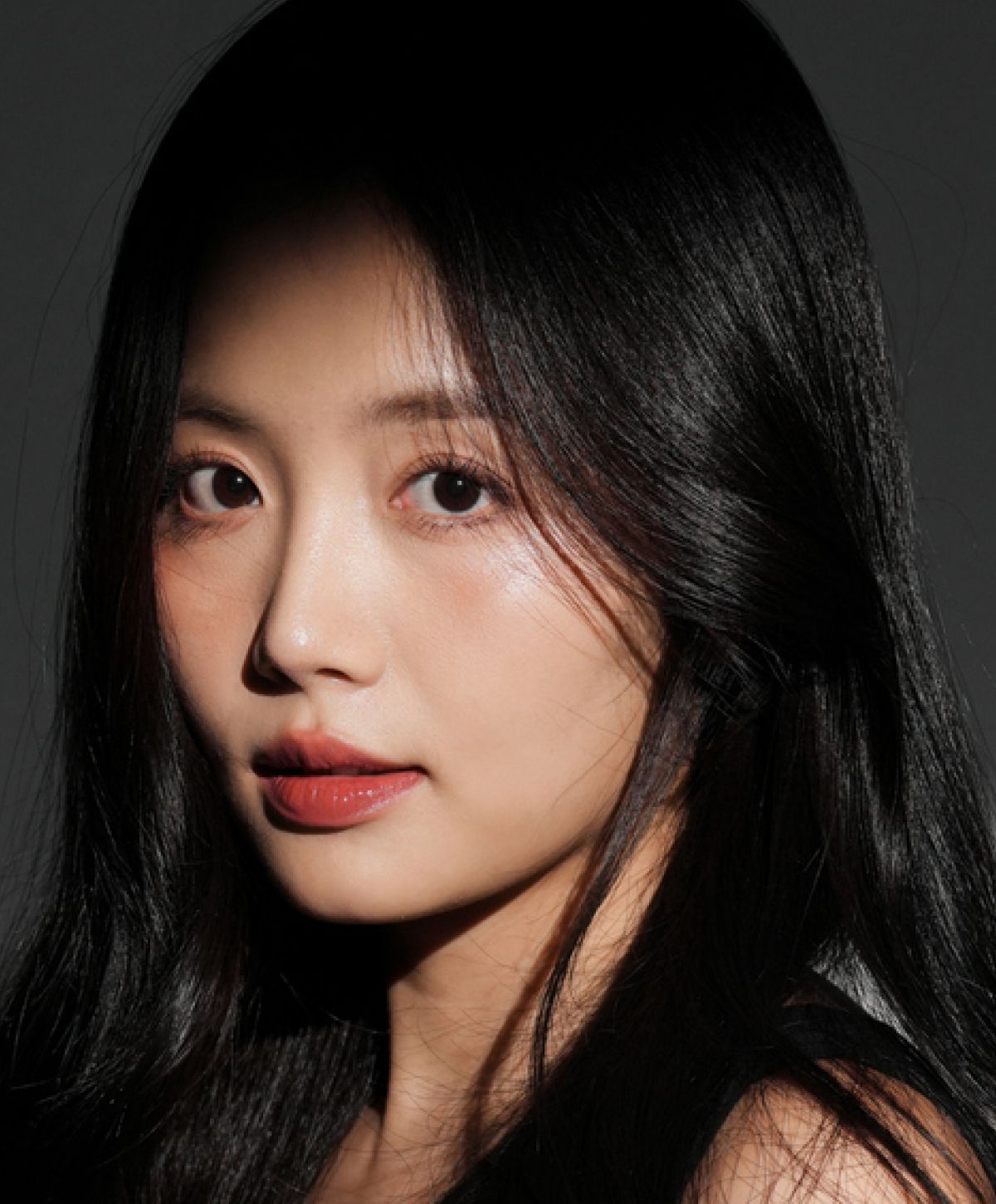 Profile of a woman with long black hair.