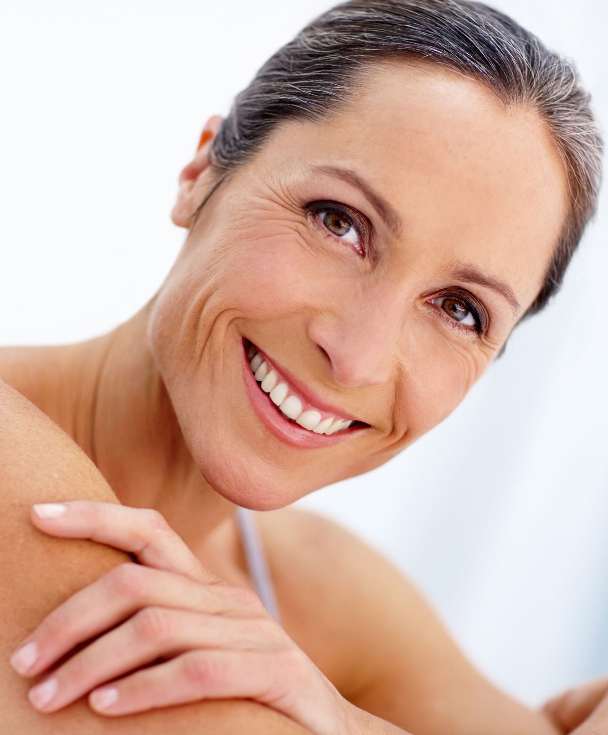Smiling woman with natural beauty and confidence.