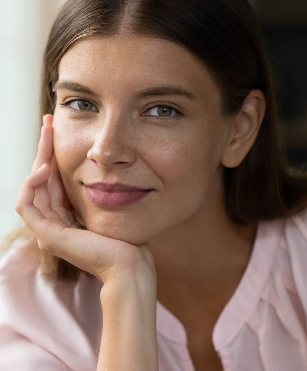 Woman in black outfit, posing indoors.
