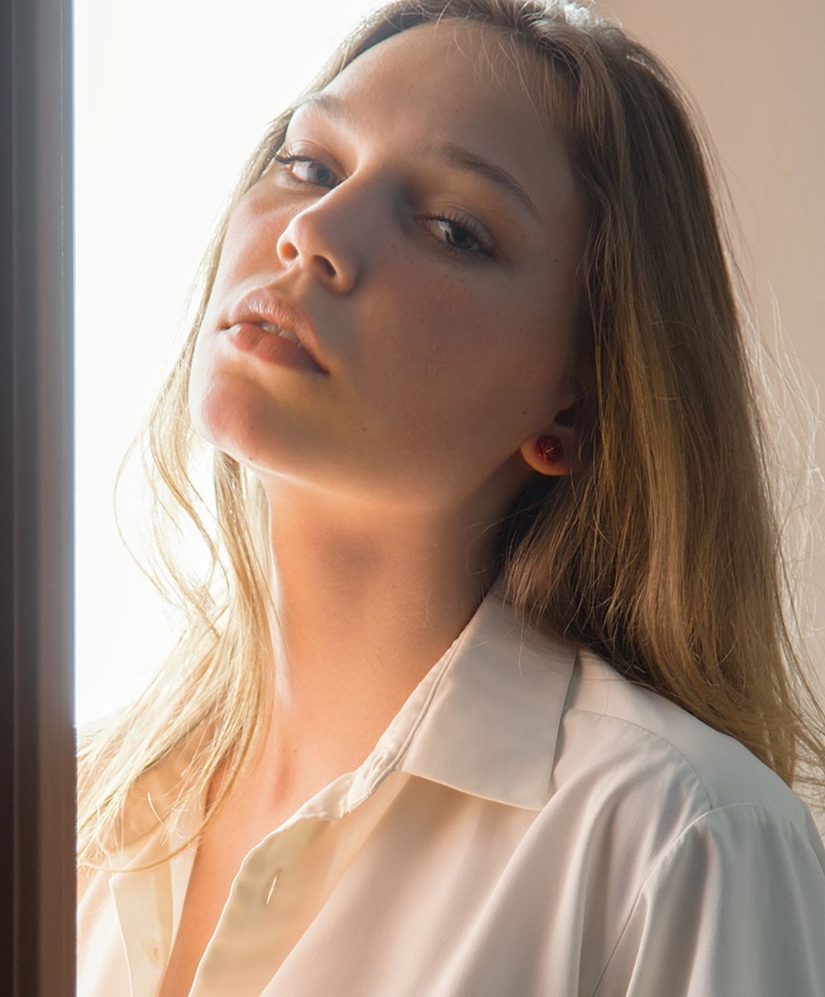 Portrait of a woman with long, wavy hair.