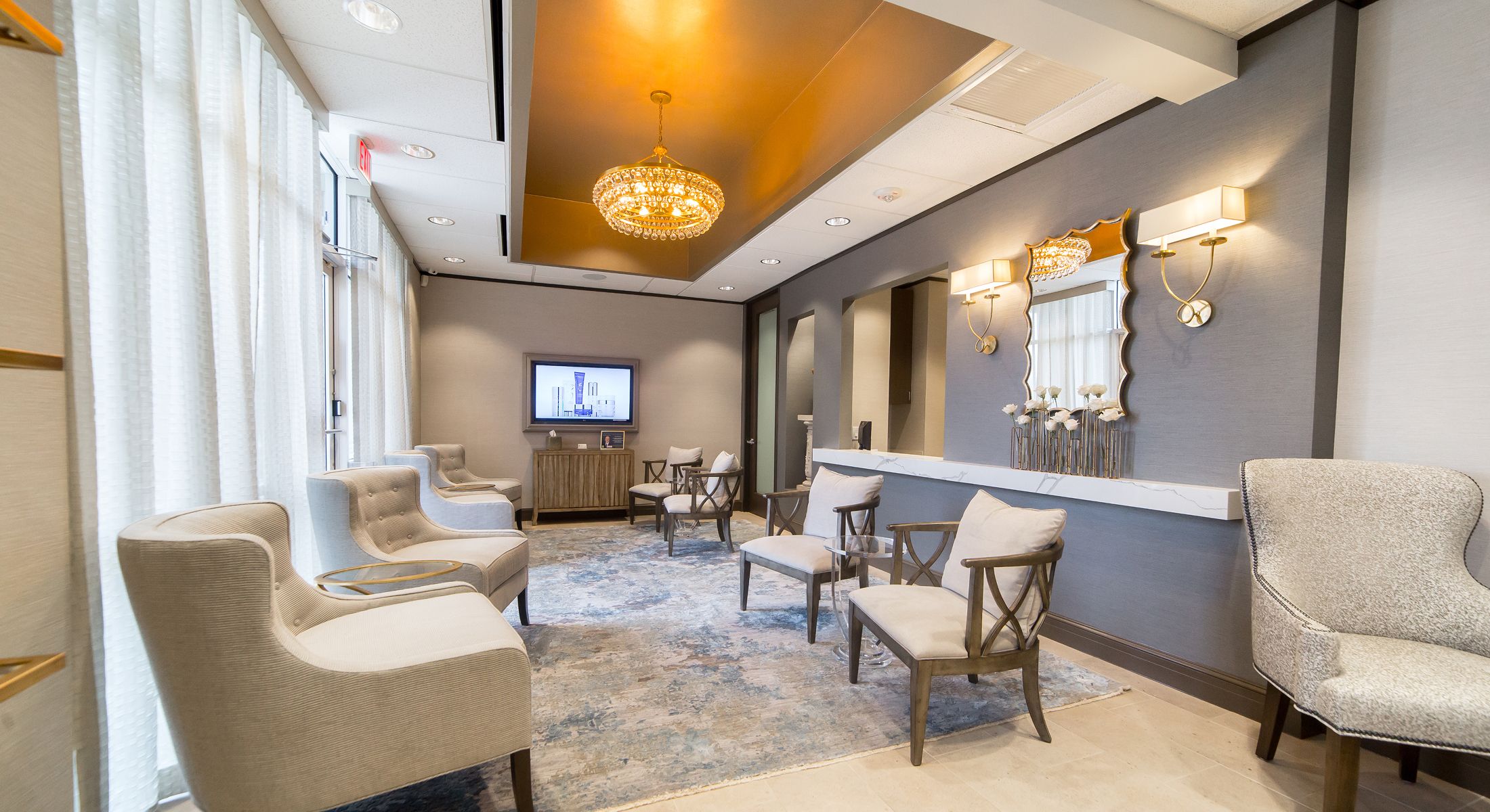 Modern waiting room with elegant decor and lighting.