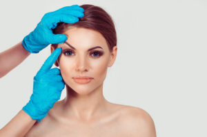 Woman being consulted about eyelid surgery
