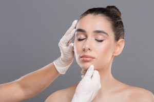 Woman getting a cosmetic surgery consultation