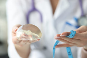 Doctor explaining when breast implants should be replaced
