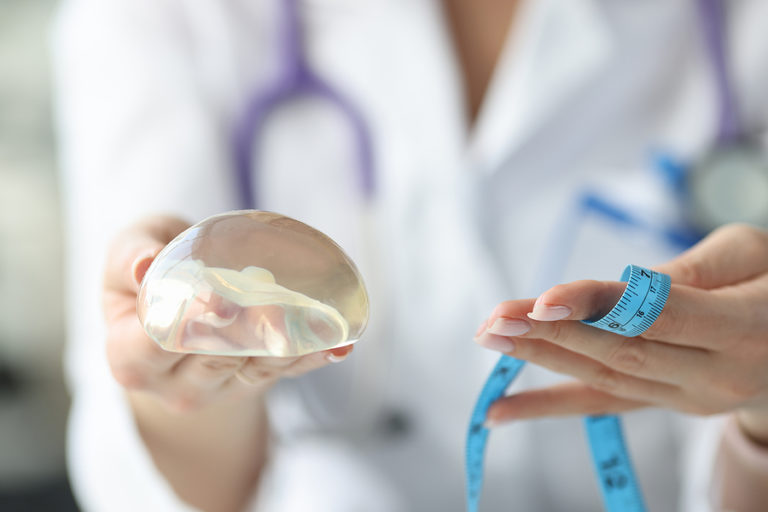 Doctor explaining when breast implants should be replaced